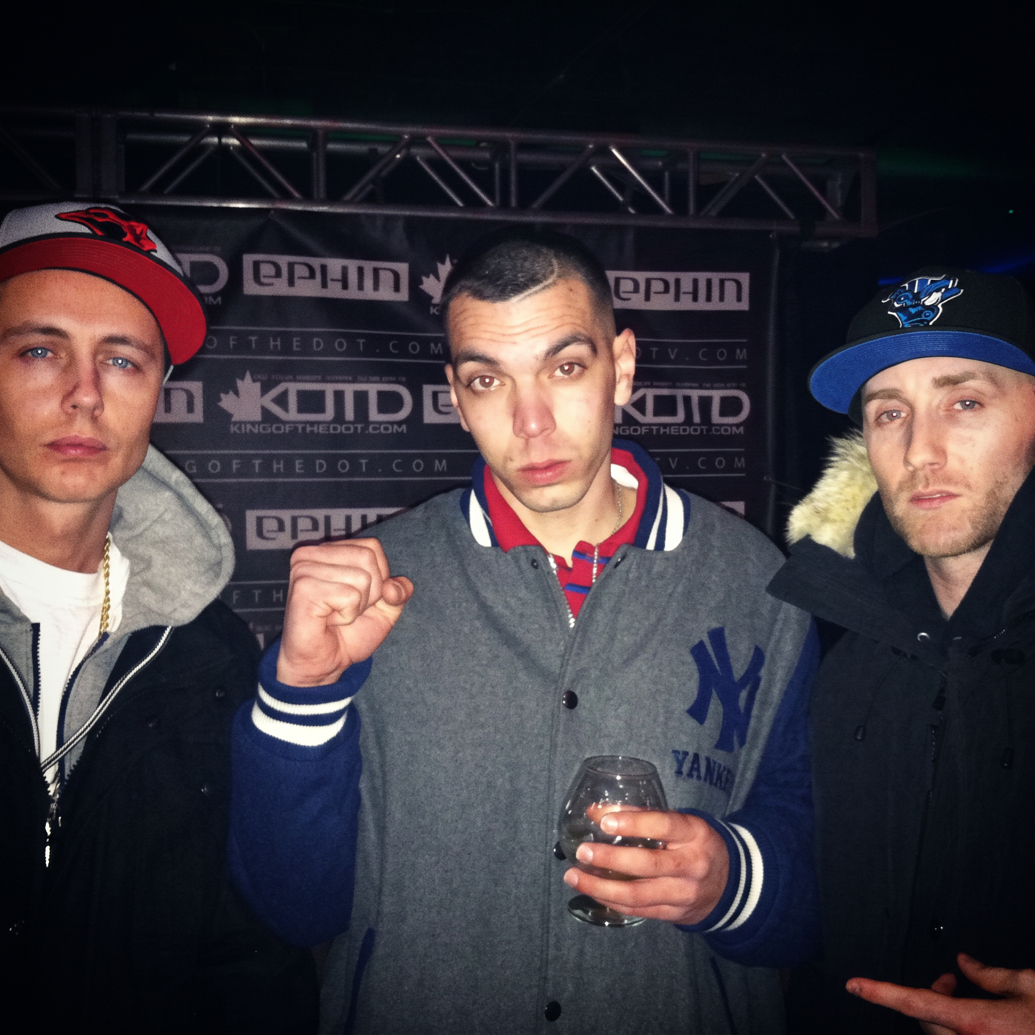 Chris Lee Quigley with two artists at a King of the Dot event