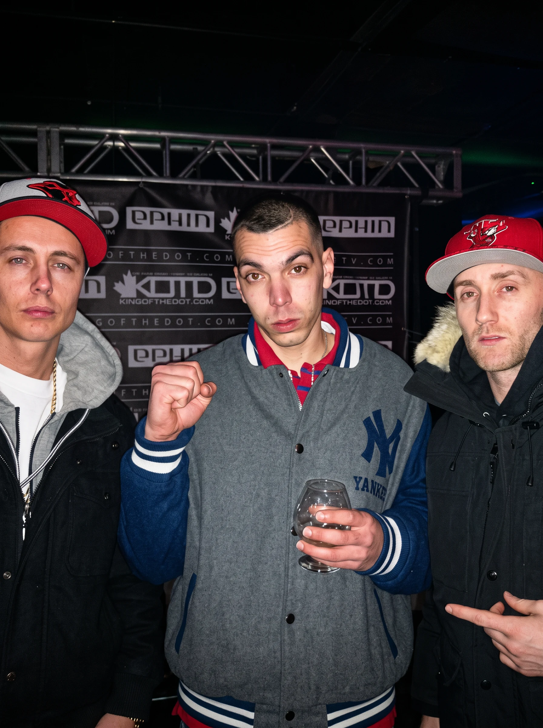 Chris Lee Quigley with two artists at a King of the Dot event